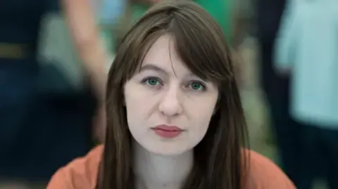 The acclaimed novelist claims she cannot visit the UK because of arrest fears